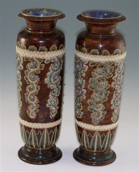 George Tinworth for Doulton Lambeth. A pair of stoneware vases, c.1871, height 32cm (12.5in.), one rim damaged